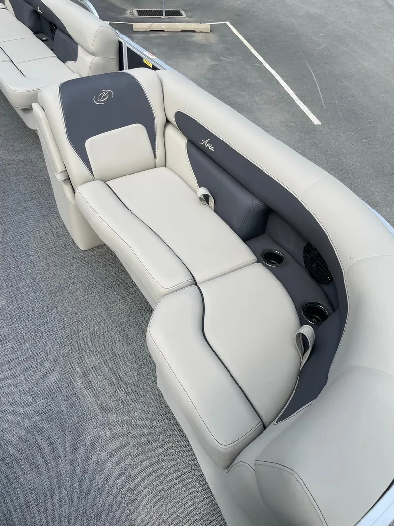 Slide: The Image of 2024 Barletta Aria 22CC boat interior seating with cup holders. - 6