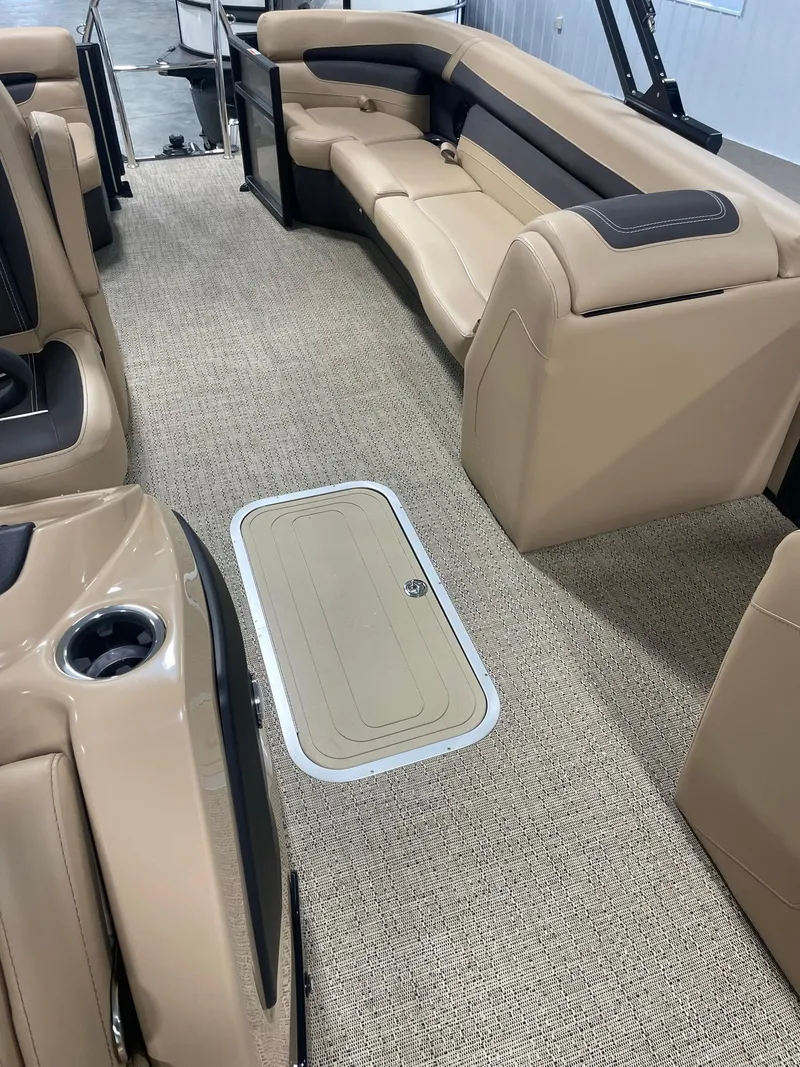Slide: The Image of 2024 Barletta Cabrio 22Q interior with beige seating and carpeted flooring. - 11