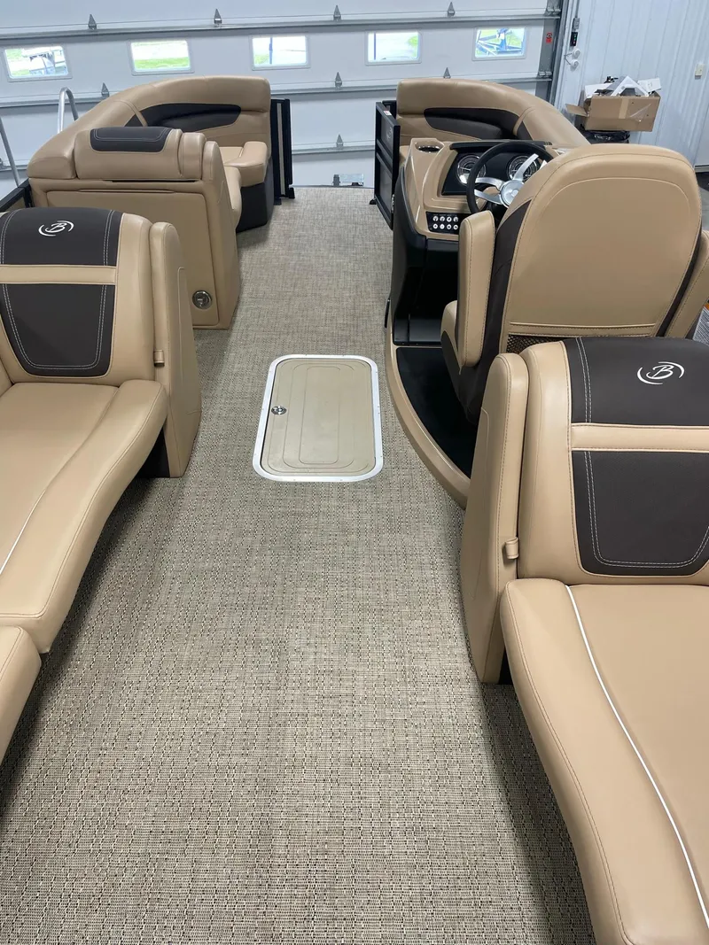 Slide: The Image of 2024 Barletta Cabrio 22Q interior with tan leather seating and modern dashboard. - 17