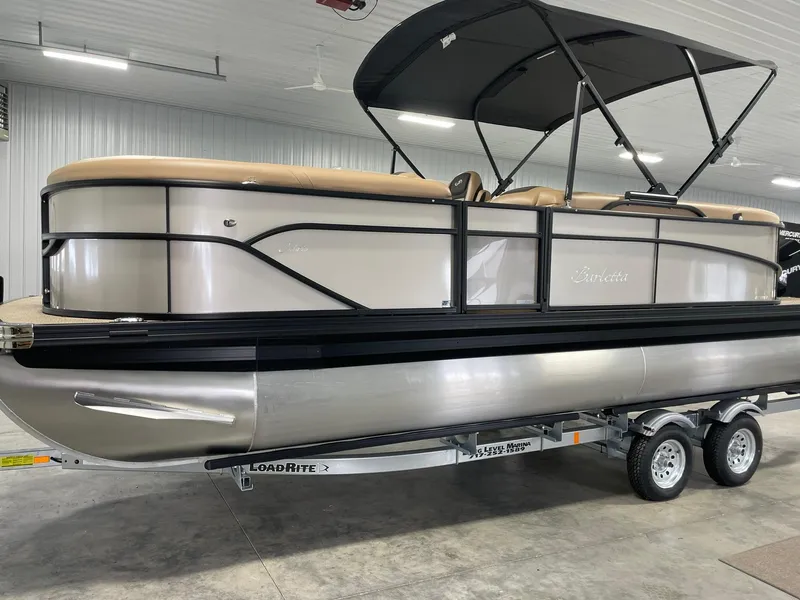 Slide: The Image of 2024 Barletta Cabrio 22Q pontoon boat on trailer in indoor storage. - 5