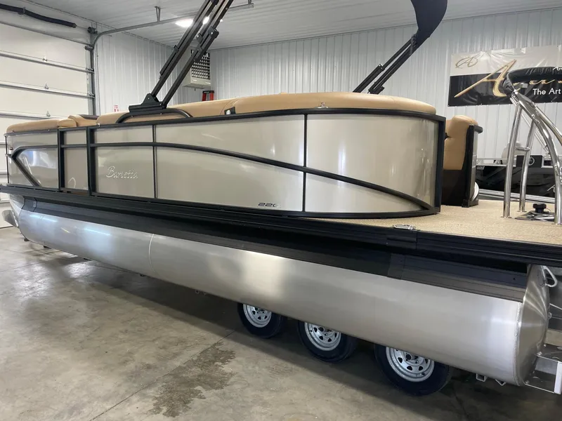 Slide: The Image of 2024 Barletta Cabrio 22Q pontoon boat in a showroom. - 7