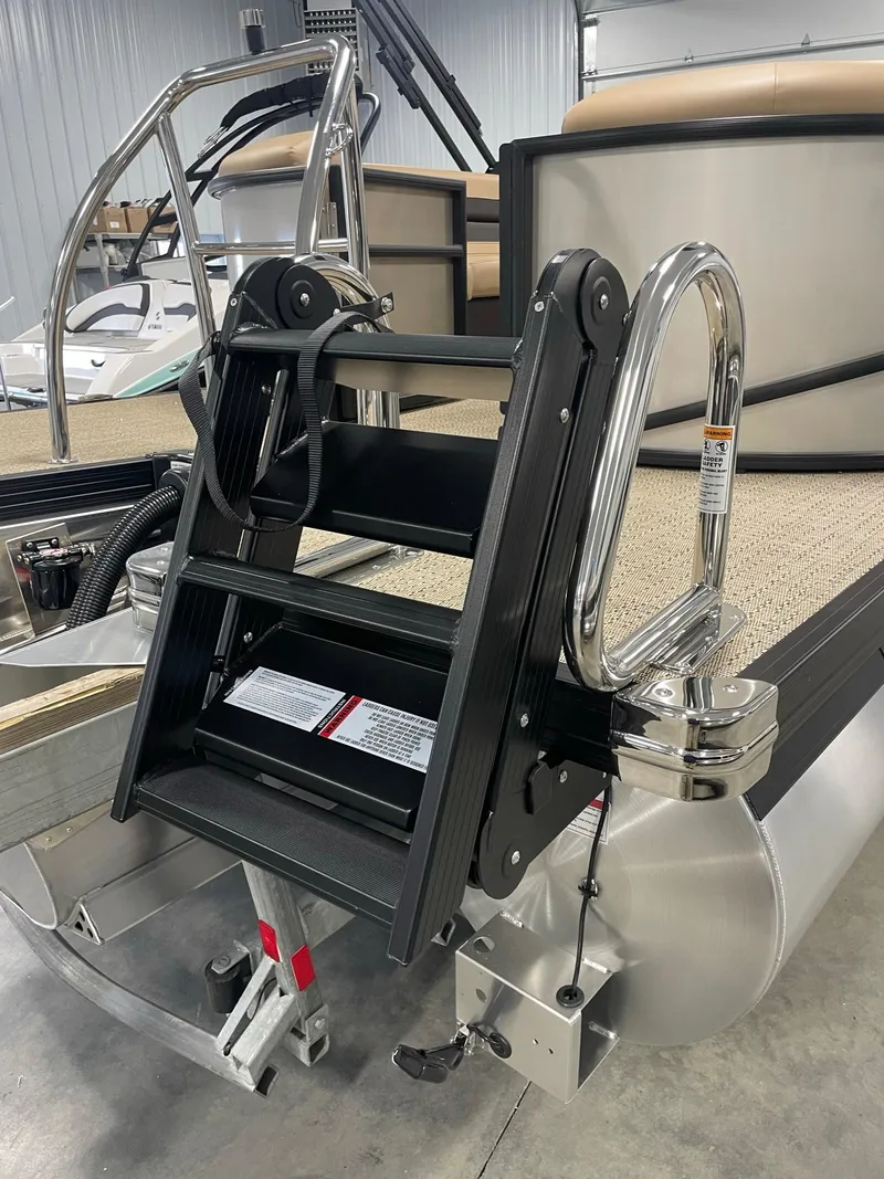 Slide: The Image of 2024 Barletta Cabrio 22Q pontoon boat with a foldable boarding ladder. - 8