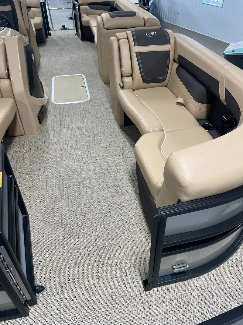 Slide: The Image of 2024 Barletta Cabrio 22Q interior with beige seating and carpet flooring. - 9