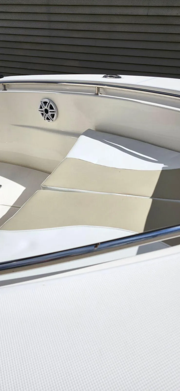 Slide: The Image of 2021 Bulls Bay 200 CC boat interior with cushioned seating and speaker. - 10