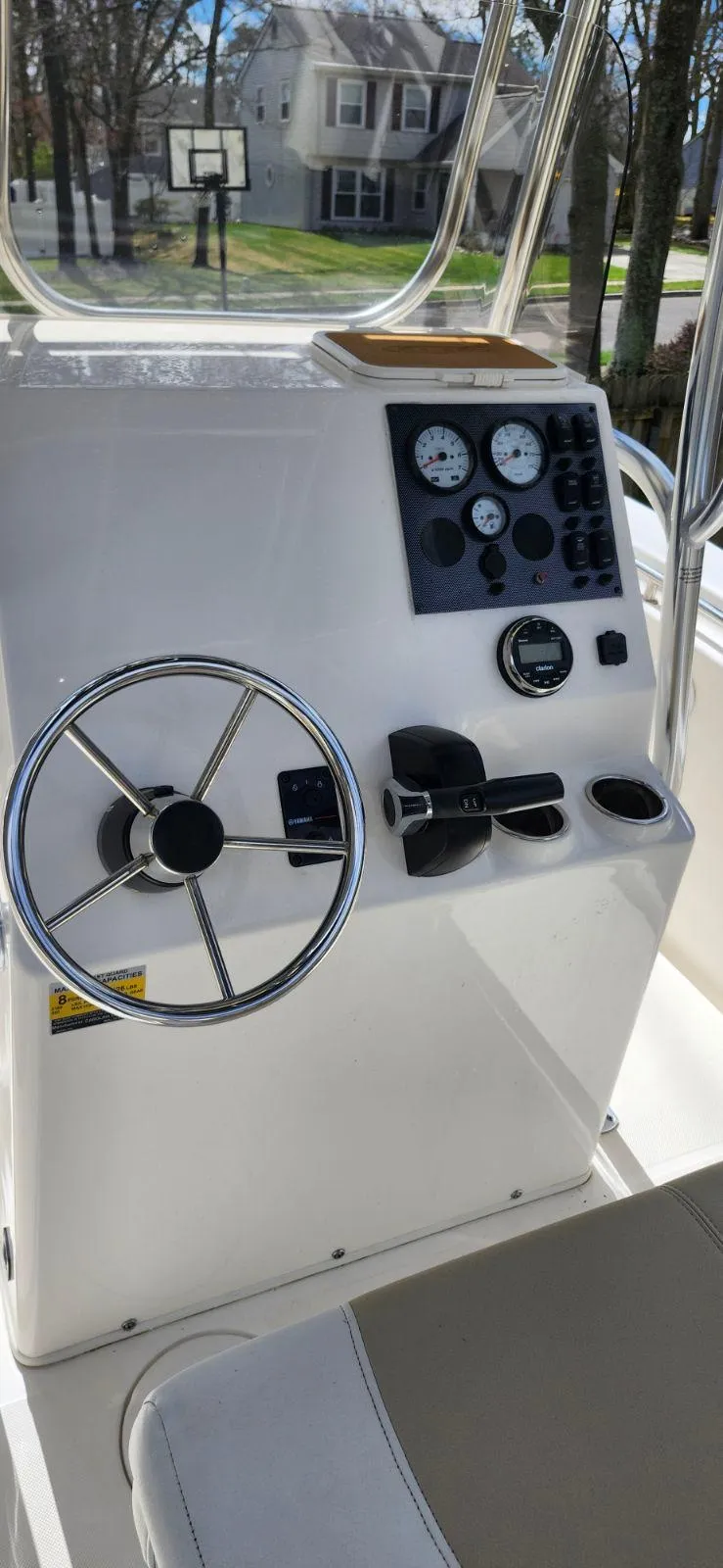 Slide: The Image of 2021 Bulls Bay 200 CC boat console with steering wheel and gauges. - 11