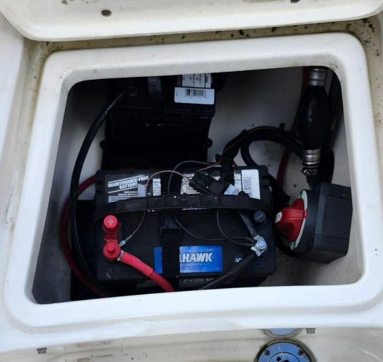 Slide: The Image of Battery compartment of a 2021 Bulls Bay 200 CC boat, featuring wiring and connections. - 12