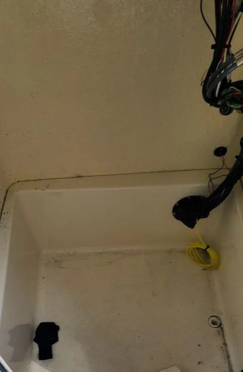 Slide: The Image of Interior view of a 2021 Bulls Bay 200 CC boat compartment with wiring. - 14