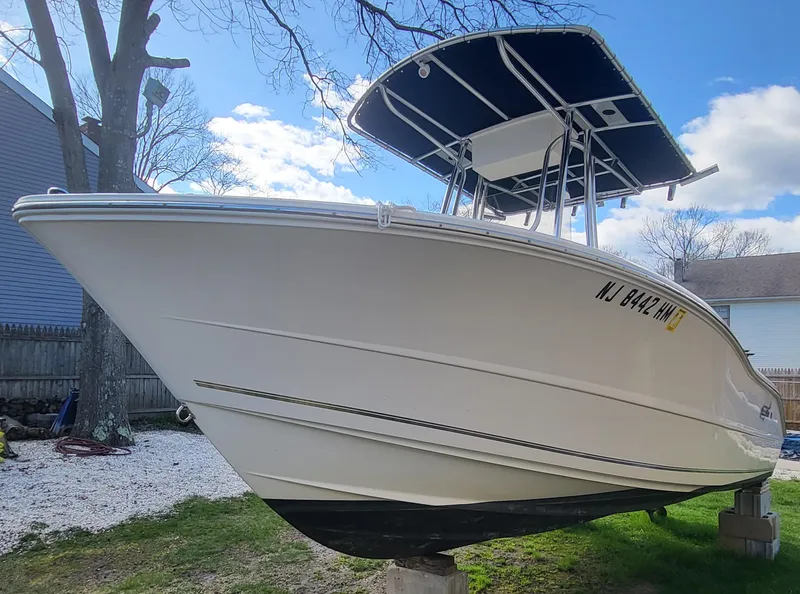 Slide: The Image of 2021 Bulls Bay 200 CC boat with T-top, parked on grass. - 18