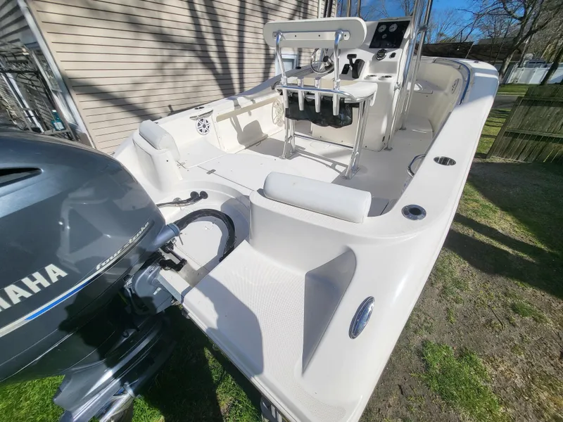 Slide: The Image of 2021 Bulls Bay 200 CC boat with Yamaha engine, parked outdoors. - 19