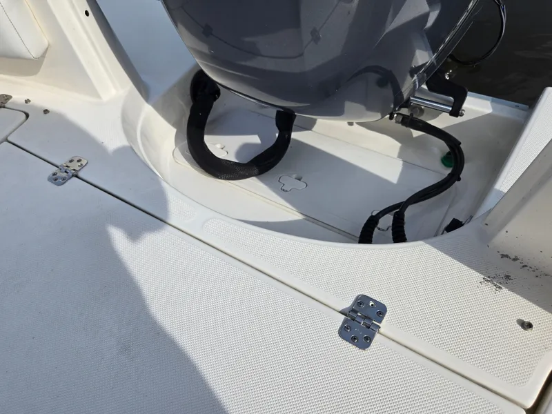 Slide: The Image of 2021 Bulls Bay 200 CC boat deck with motor and storage compartment. - 38