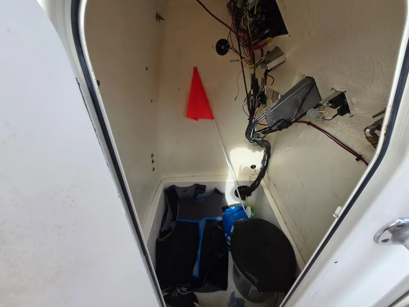 Slide: The Image of Interior view of a 2021 Bulls Bay 200 CC boat compartment with wiring and equipment. - 41