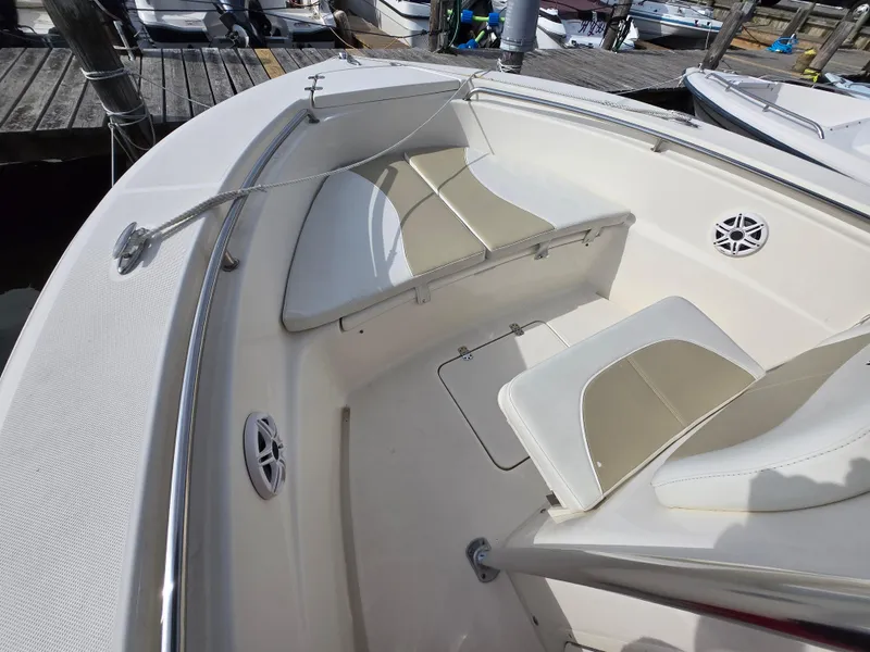 Slide: The Image of 2021 Bulls Bay 200 CC boat interior with white seating and deck details. - 43