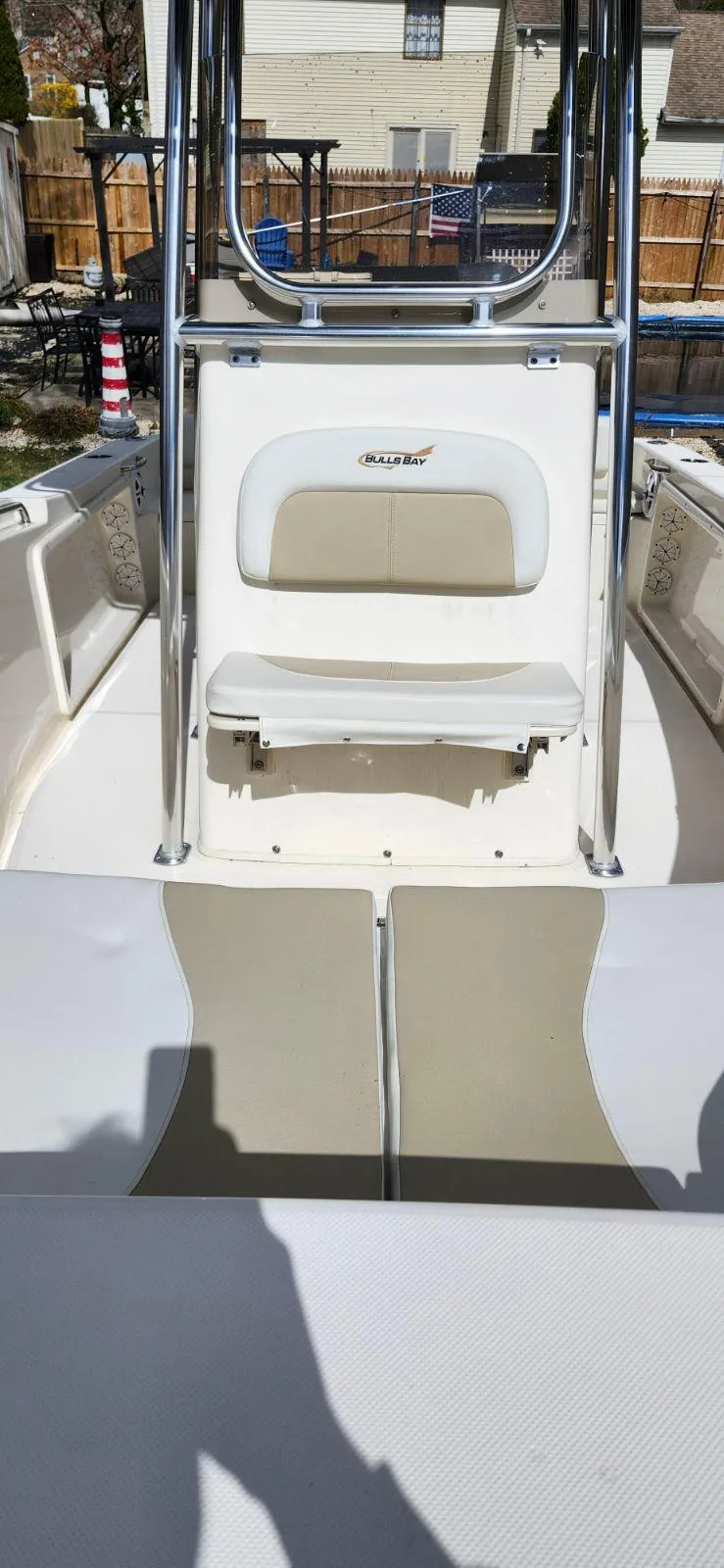 Slide: The Image of 2021 Bulls Bay 200 CC boat interior with seating and console, outdoor setting. - 6