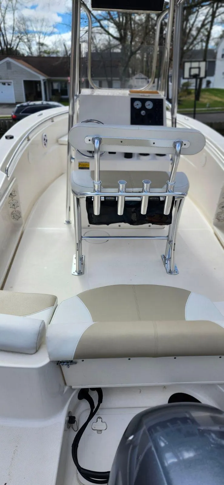 Slide: The Image of 2021 Bulls Bay 200 CC boat interior with seating and console, outdoors. - 7