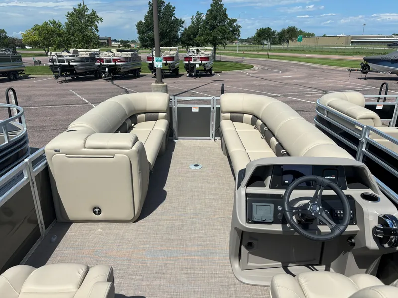 Slide: The Image of 2024 Sun Tracker Party Barge 24 DLX pontoon boat with spacious seating and modern helm. - 11