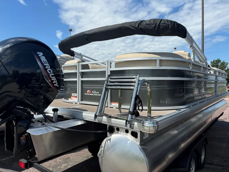 Slide: The Image of 2024 Sun Tracker Party Barge 24 DLX pontoon boat with Mercury outboard motor. - 3