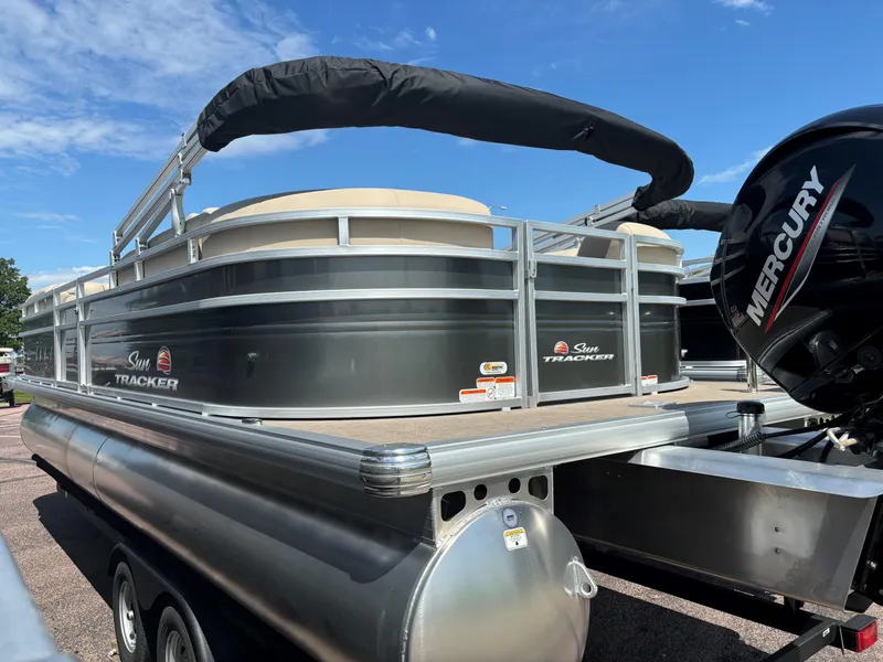 Slide: The Image of 2024 Sun Tracker Party Barge 24 DLX pontoon boat with Mercury outboard motor. - 4