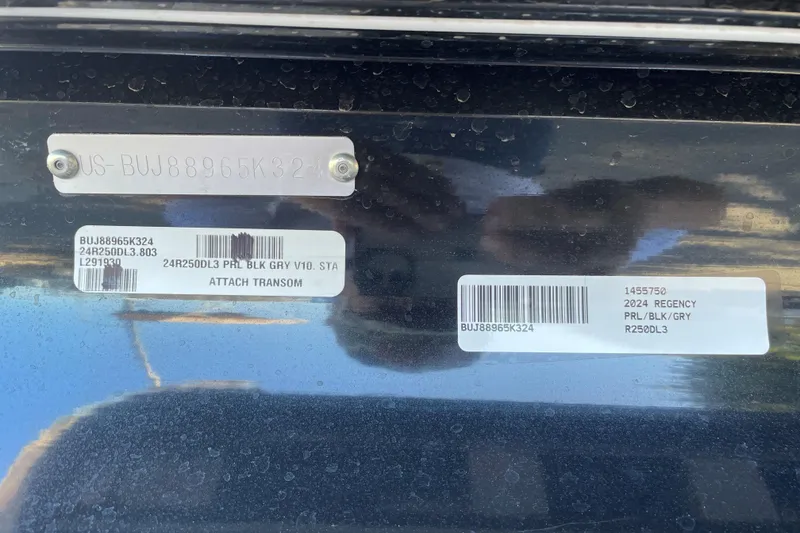 Slide: The Image of 2024 Regency 250 DL3 boat identification tags with serial numbers and model details. - 64