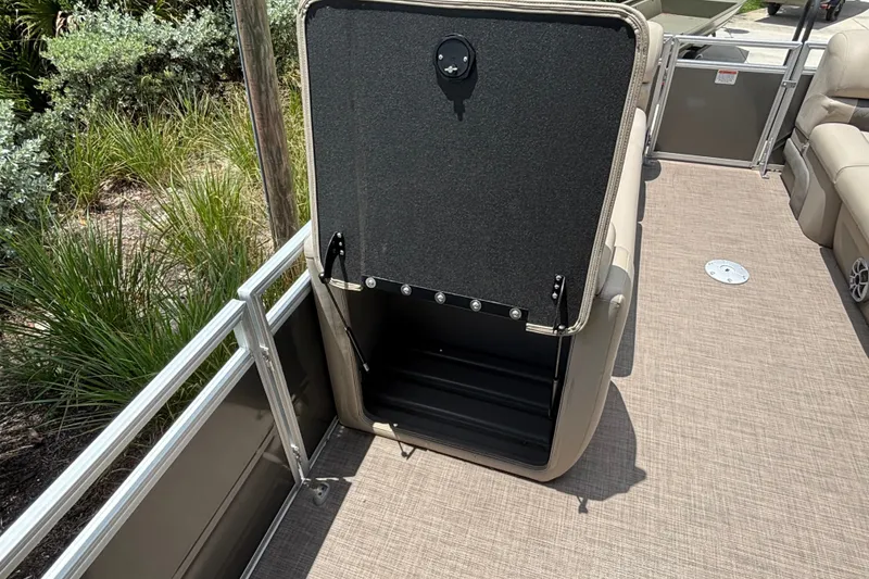 Slide: The Image of 2024 Sun Tracker Party Barge 24 DLX storage compartment open on deck. - 15