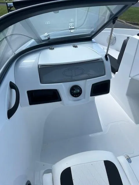 Slide: The Image of 2024 Tahoe 185 S boat interior with dashboard and seating. - 10