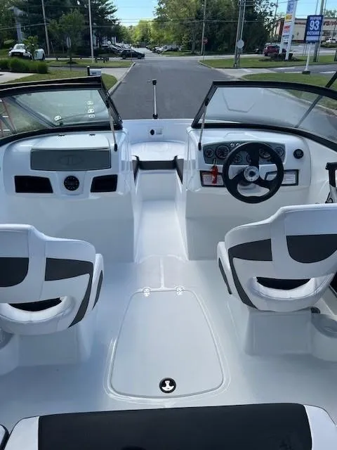 Slide: The Image of 2024 Tahoe 185 S boat interior with dual seats and dashboard. - 6