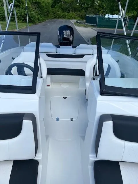 Slide: The Image of 2024 Tahoe 185 S boat interior with black and white seating. - 7