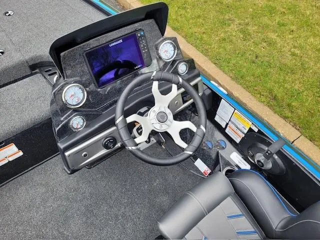 Slide: The Image of 2024 Nitro Z19 Pro boat dashboard with steering wheel and electronic display. - 3