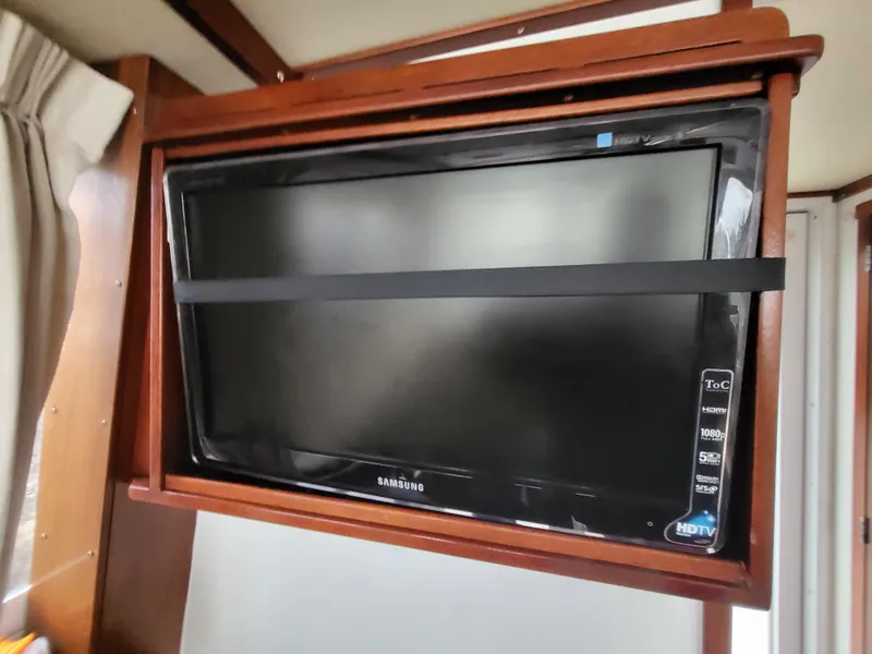 Slide: The Image of Samsung HDTV mounted in a 2012 Crusader Boats outboard cruiser interior. - 16