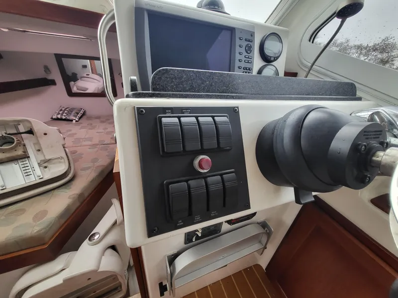 Slide: The Image of Control panel of a 2012 Crusader Boats outboard cruiser with navigation equipment. - 20