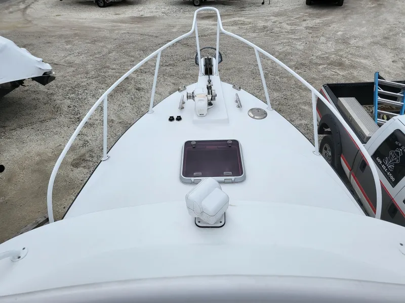 Slide: The Image of 2012 Crusader Boats outboard cruiser, top view of bow with railing and hatch. - 33
