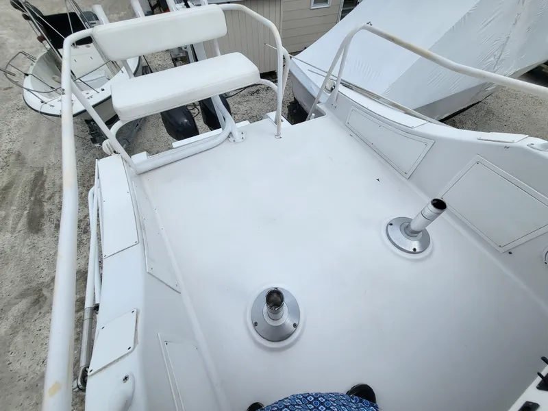 Slide: The Image of 2012 Crusader Boats outboard cruiser deck with seating and railing, viewed from above. - 34