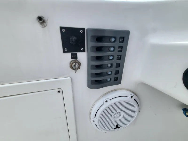 Slide: The Image of Control panel and speaker on 2012 Crusader Boats outboard cruiser. - 41
