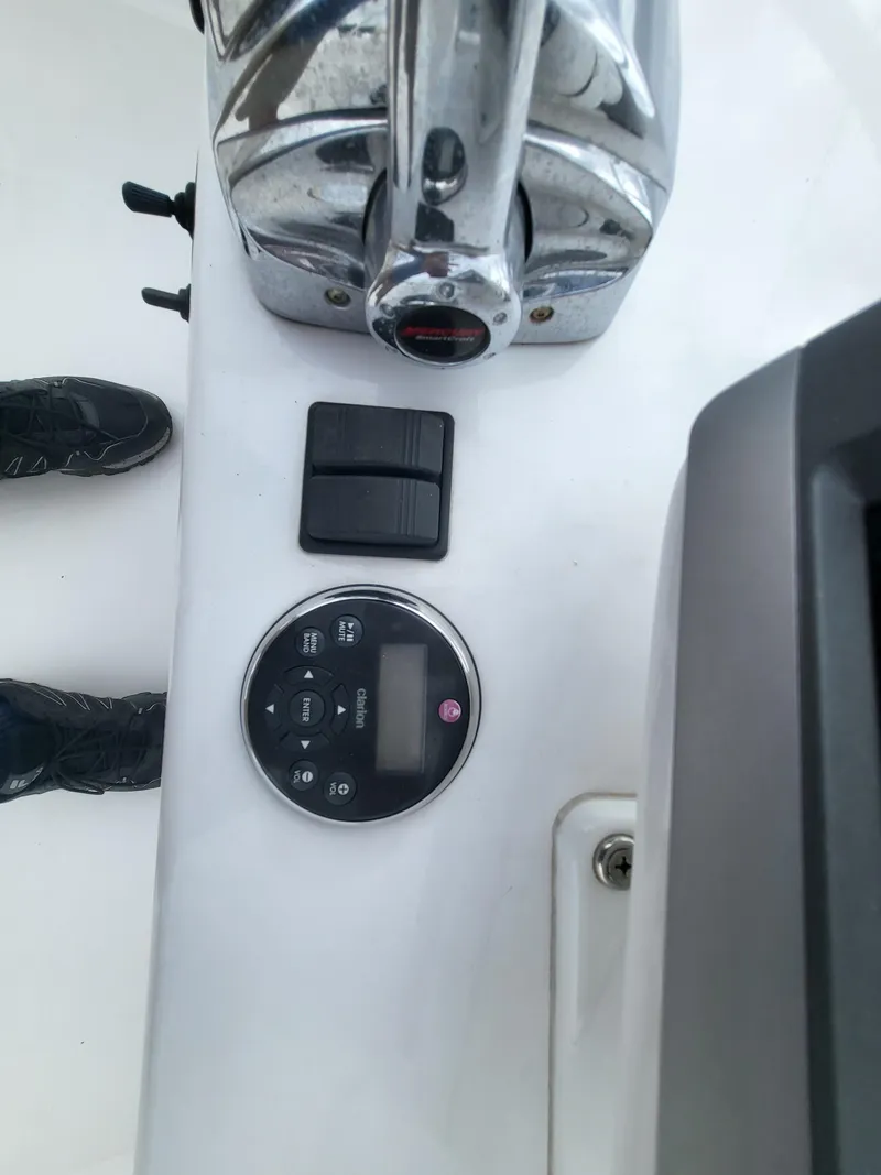 Slide: The Image of Control panel of a 2012 Crusader Boats outboard cruiser with throttle and display. - 43