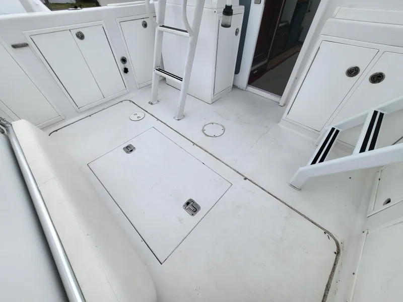 Slide: The Image of 2012 Crusader Boats outboard cruiser deck with storage compartments and ladder. - 46