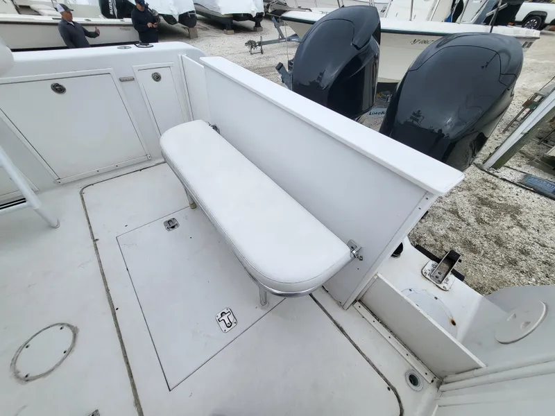 Slide: The Image of 2012 Crusader Boats outboard cruiser with white seating and dual engines. - 49