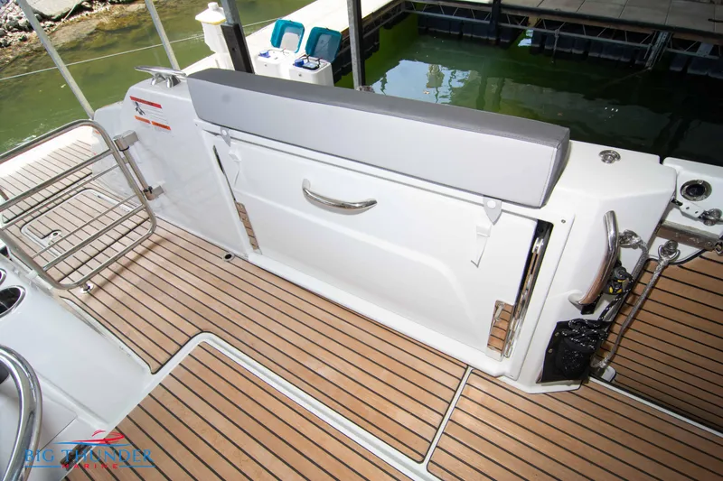 Slide: The Image of 2024 Jeanneau Leader 10.5 WA boat deck with teak flooring and seating. - 21