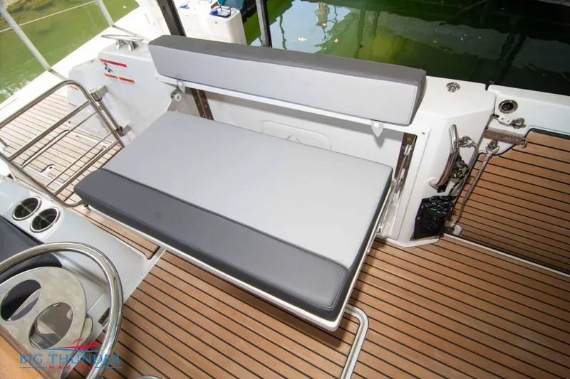 Slide: The Image of Jeanneau Leader 10.5 WA 2024 boat seating area with teak flooring. - 22