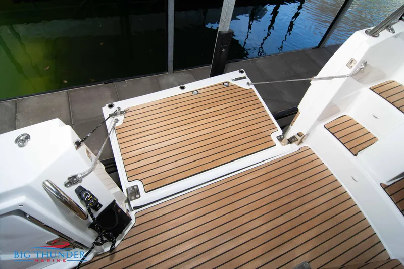 Slide: The Image of 2024 Jeanneau Leader 10.5 WA boat deck with teak flooring - 23