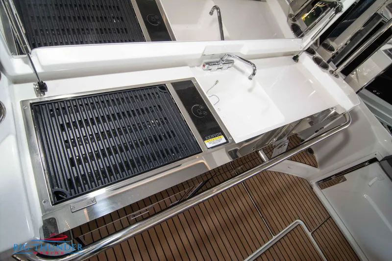Slide: The Image of 2024 Jeanneau Leader 10.5 WA boat kitchen with grill and sink. - 25