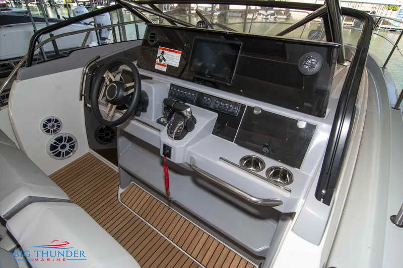 Slide: The Image of Helm station of 2024 Jeanneau Leader 10.5 WA with modern controls and navigation equipment. - 32