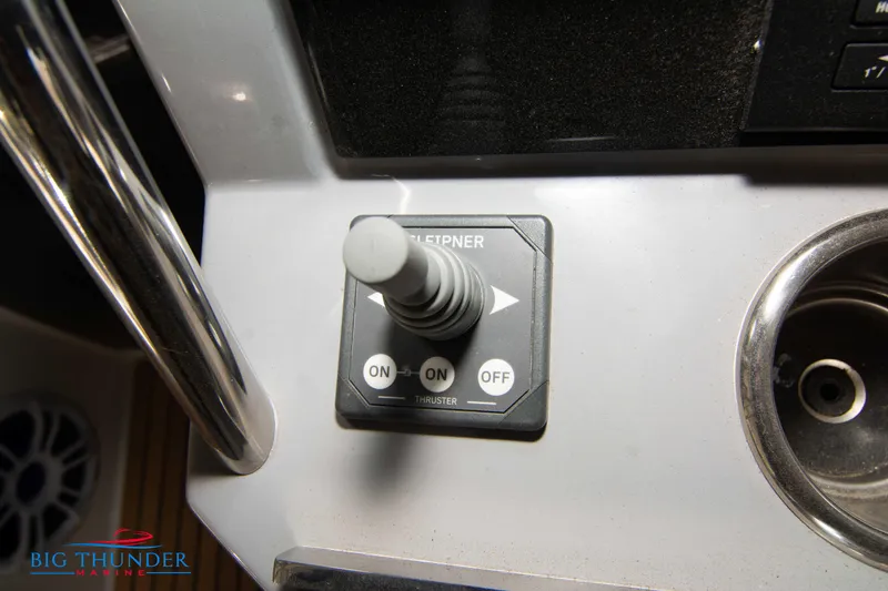 Slide: The Image of Joystick control on 2024 Jeanneau Leader 10.5 WA boat dashboard. - 39