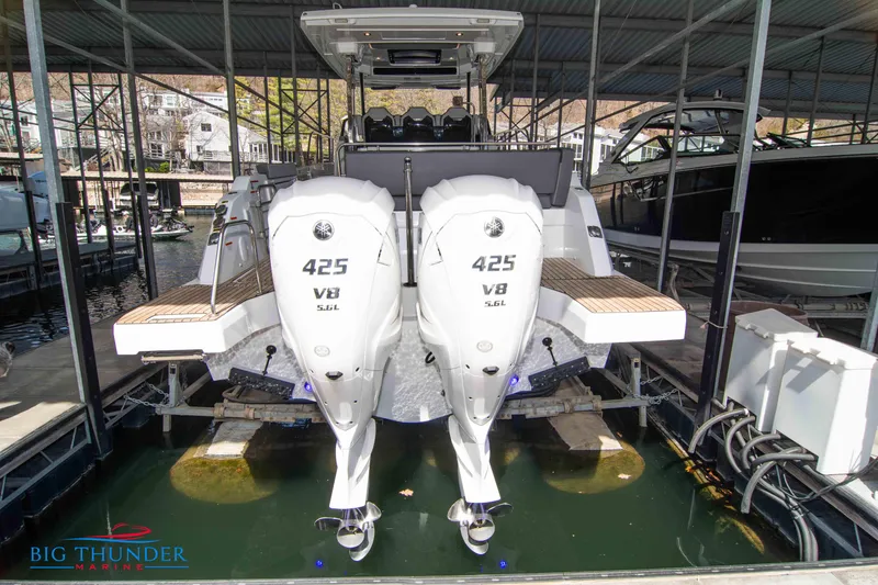Slide: The Image of 2024 Jeanneau Leader 10.5 WA with twin 425 V8 engines docked in marina. - 4