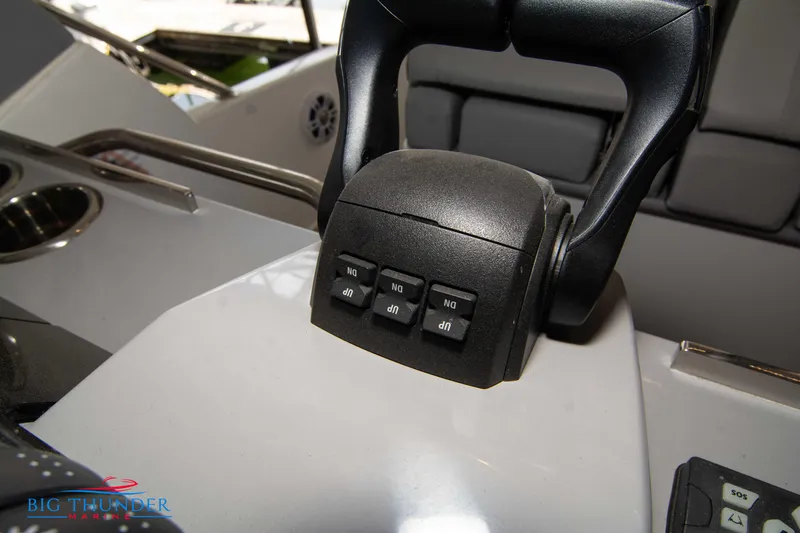 Slide: The Image of 2024 Jeanneau Leader 10.5 WA throttle control on boat dashboard. - 42