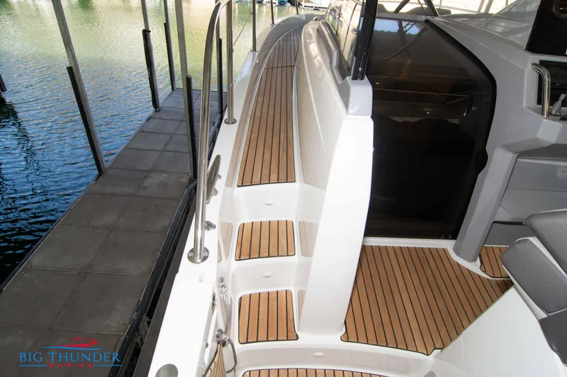 Slide: The Image of 2024 Jeanneau Leader 10.5 WA boat deck with teak flooring. - 47