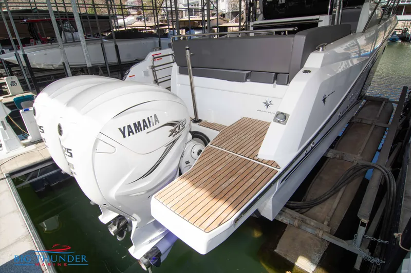 Slide: The Image of 2024 Jeanneau Leader 10.5 WA with Yamaha outboard engines on a dock. - 7