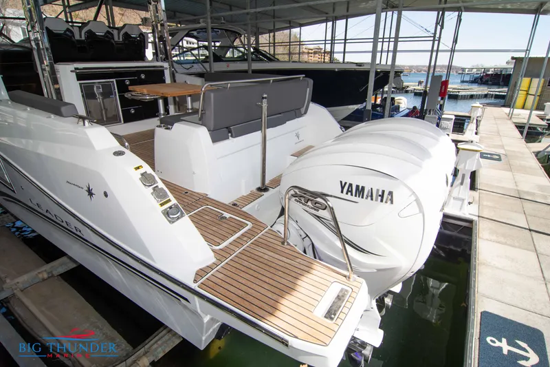 Slide: The Image of 2024 Jeanneau Leader 10.5 WA with Yamaha engines docked at marina. - 8