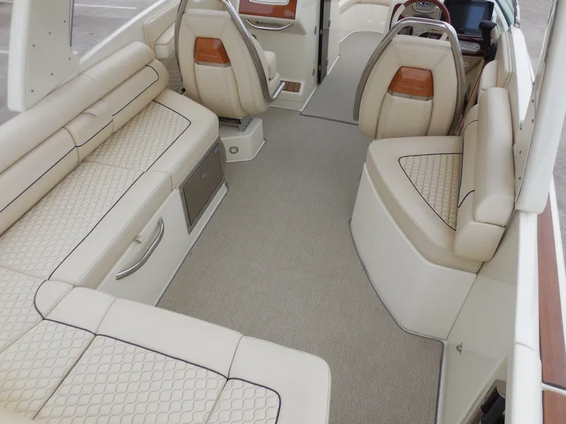 Slide: The Image of 2019 Chris-Craft Launch 28 GT interior with luxurious beige seating and modern design. - 10