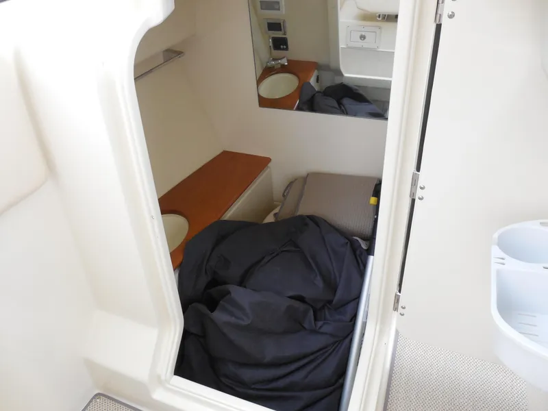 Slide: The Image of 2019 Chris-Craft Launch 28 GT cabin interior with bed and sink. - 14