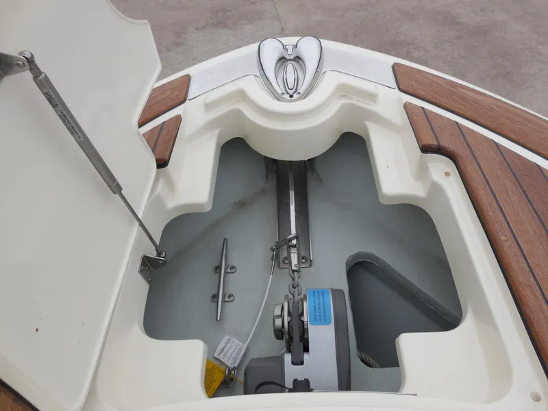 Slide: The Image of 2019 Chris-Craft Launch 28 GT anchor storage compartment with wooden deck accents. - 17