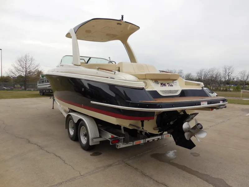Slide: The Image of 2019 Chris-Craft Launch 28 GT boat on a trailer, rear view. - 5